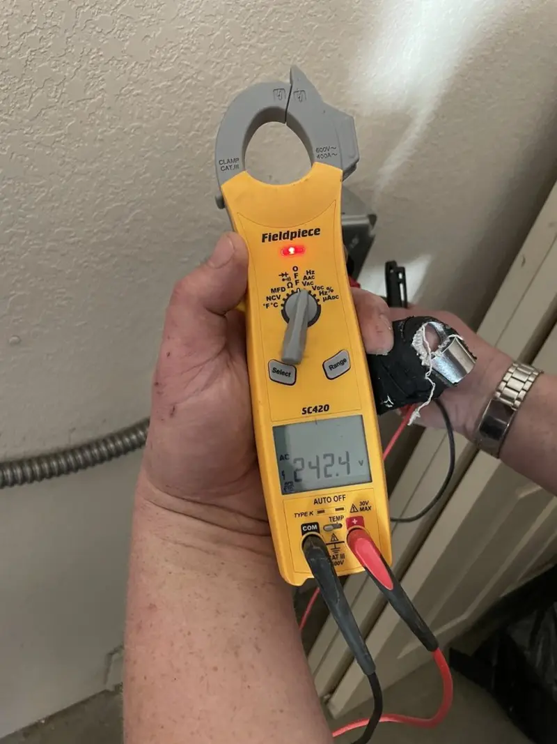 Voltage testing with clamp meter during Outlet Installation in Salem